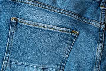 Fototapeta premium Backside denim blue jeans with pocket for background. Premium quality fabric with perfect seams.