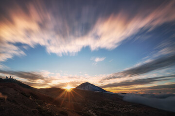 mountain landscape with clouds and sunset warm colors