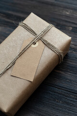 Handcraft christmas present wrapped with recicled craft paper