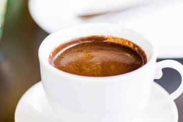 Turkish cup pf coffee, dark coffee close-up and macro, hot aromatic drink