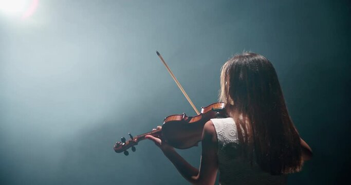 Professional violinist, female musician playing the violin, 4k video