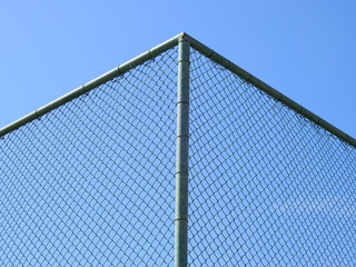 wire mesh of fence with blue sky background