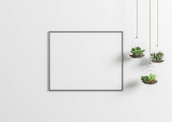 Interior frame mock up with horizontal metal frame and plants in vase on white wall background. 3D rendering.
