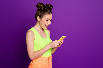 Profile side view portrait of attractive cheerful girl using gadget browse post app 5g isolated over bright violet color background