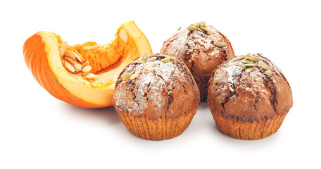 Tasty pumpkin muffins on white background