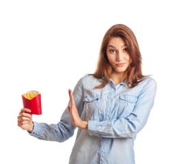 Young woman refusing to eat french fries on white background