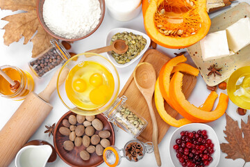 Ingredients for preparing pumpkin pie on white background