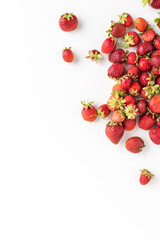 Organic strawberries on white background with copyspace. Real food concept