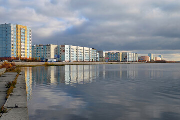 View at residential houses on the bank of Yantarnoye (Amber) lake. Nadym, Yamalo-Nenets Autonomous Okrug (Yamal), Russia.