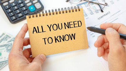 Notebook with text - All you need to know - near office supplies.