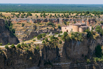 Fototapeta premium In the Natural Park of the Hoces of River Duraton view of the Hermitage of San Frutos on a precipice, photo two. Photograph taken in Segovia, Spain.