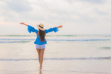Portrait beautiful young asian woman relax leisure smile around beach sea ocean