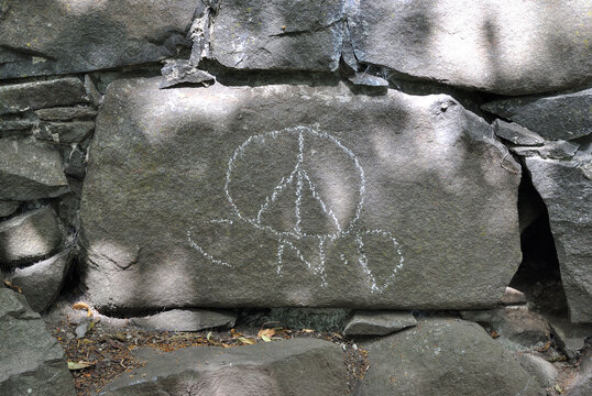 Rustic Stone Wall with Chalked Message & Symbol 
