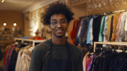 Portrait of african male owner of fashion store smiling at camera