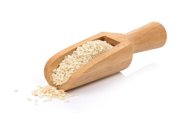 sesame seeds in wooden scoop on white background