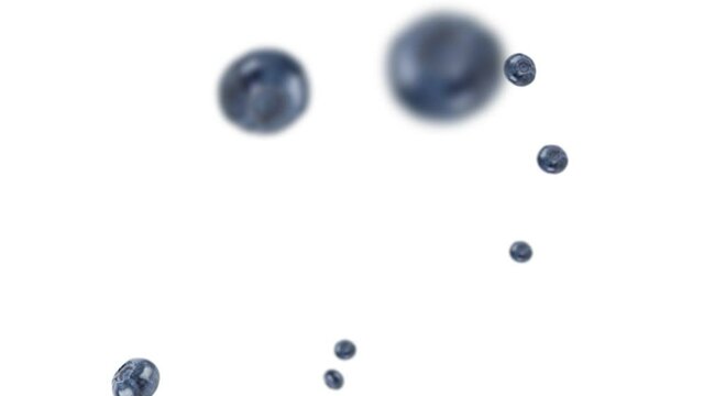 Many blueberries exploding and free falling on white background. Selective focus - shallow depth of field.