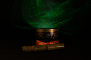 Tibetan bowl with low key green light effect