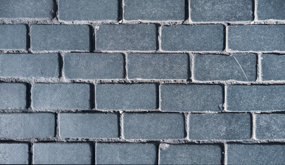 Walkway of dark gray stone tiles close-up