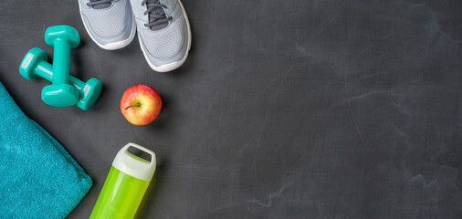 Fitness equipment on a dark background with copyspace