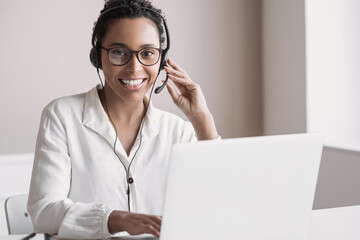 Distance education, e-learning concept. Woman using laptop computer at home, studying online....