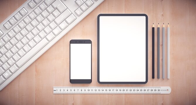 Responsive web design development. Work table with tablet, smartphone and keyboard.