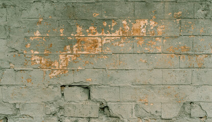 Grunge paternal walls of the old building. color on the outer wall of building. Old building with falling off plaster. Background of brick wall pattern.