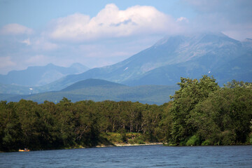 Russia, Kamchatka. 08.22.2008: River Malkinskaya Bystraya. Tourists on a raft floating on the...