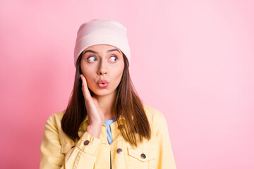 Photo of funny sweet young lady wear casual outfit headwear arm cheek lips pouted isolated pink color background