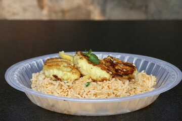 Fried Rice in a disposable plate with Cheesy Grilled Chicken