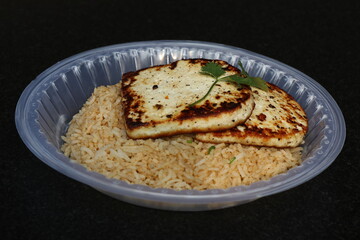 Fried Rice in a disposable plate with Cheesy Grilled Chicken
