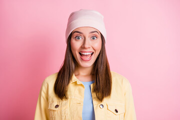 Photo of shiny surprised young lady wear casual outfit headwear open mouth isolated pink color background