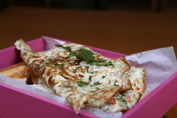 Serving of an omelet with a garnish of coriander
