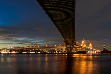 Fototapeta na wymiar Large suspension bridge over Chao Phraya river at twilight