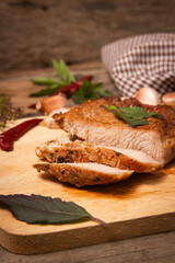 Roast pork on a cutting board.