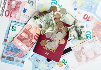 Cash on table isolated: dollars, euro, rubl broken money. All in mess, global crisis . passport travel concept