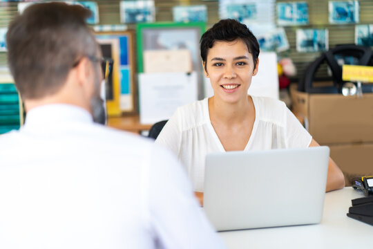 Attractive Caucasian Women In Counter Service. Female  receptionist.