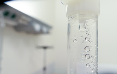Fluid Drug Dripping from Intravenous Therapy Drip-Bag in Hospital Room