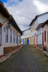 Fototapeta na wymiar Typical street at historical city of Sao Joao del Rei, known as crooked houses street (a Rua das Casas Tortas)