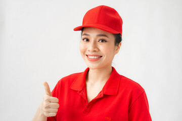 A portrait of Happy Female delivery service showing thumb up