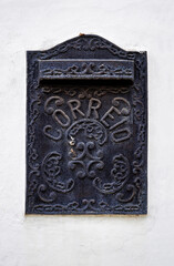 Ancient mail box on facade (