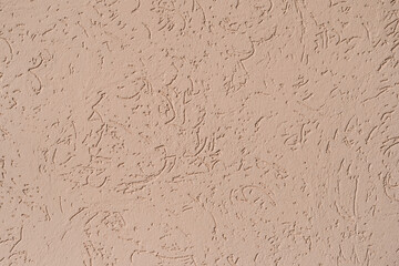 structure of wall covered with beige textured putty
