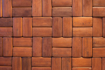 Brown wooden rectangular laminated tiles texture close up shot top view