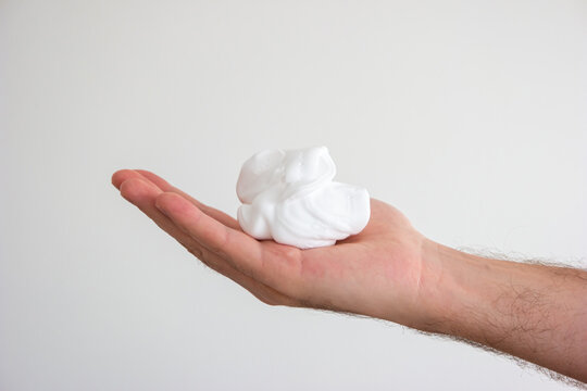 Caucasian Male Hand Holding Whipped Shaving Foam Close Up Shot Isolated