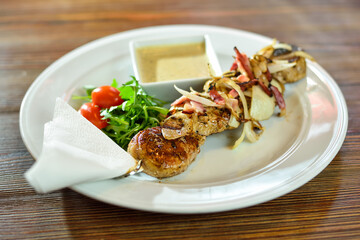 Grilled beef shishkabobs on table close up