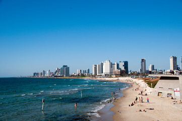 View of the city of Tel Aviv, and the beach of the Mediterranean Sea on a summer day