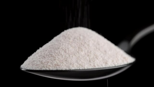 collagen. pour collagen powder in black spoon. Stylish video with collagen. Natural beauty and health supplement