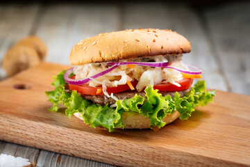 Closeup on hamburger with sauerkraut and lettuce