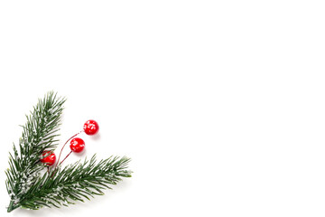 Christmas composition. Branches of a Christmas tree and red berries on a white background. Flat lay, top view, copy space