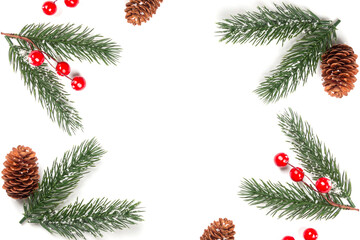 Christmas composition. Branches of a Christmas tree and red berries on a white background. Flat lay, top view, copy space