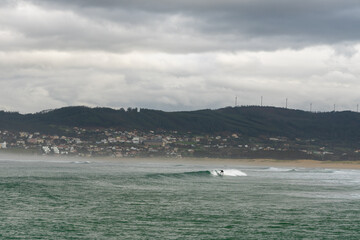 Obraz premium surfing at A Frouxeira beach in Galicia in northern Spain